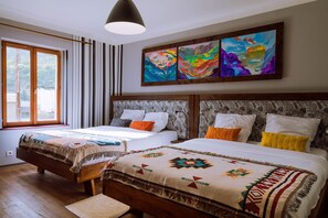 A hotel room with two beds, striped curtains, a large window, and colorful artwork on the wall. - Unique et Spacieuse Maison Centrale Dans la Vallée et Très Bien Desservie (L'Argentière-la-Bessée)