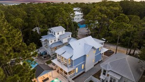 A large, multi-story house with a swimming pool and a covered patio area. - Outdoor Cabana with Pool and LSV (Santa Rosa Beach)