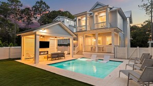A two-story house with a swimming pool, outdoor seating, and a covered patio area. - Outdoor Cabana with Pool and LSV (Santa Rosa Beach)