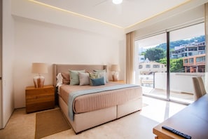 The beautiful master bedroom features a comfortable king-size bed, ensuite bathroom, smart Tv and a dedicated workspace - Soho PV • 2 Workspaces, Pool, Gym & Rooftop Bar (Puerto Vallarta)