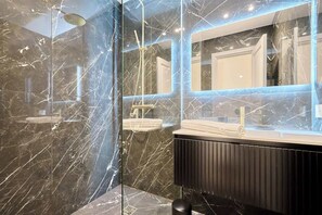 Shower, hair dryer, towels, soap