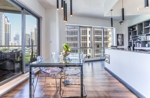 Enjoy meals in the spacious dining area with a city view.