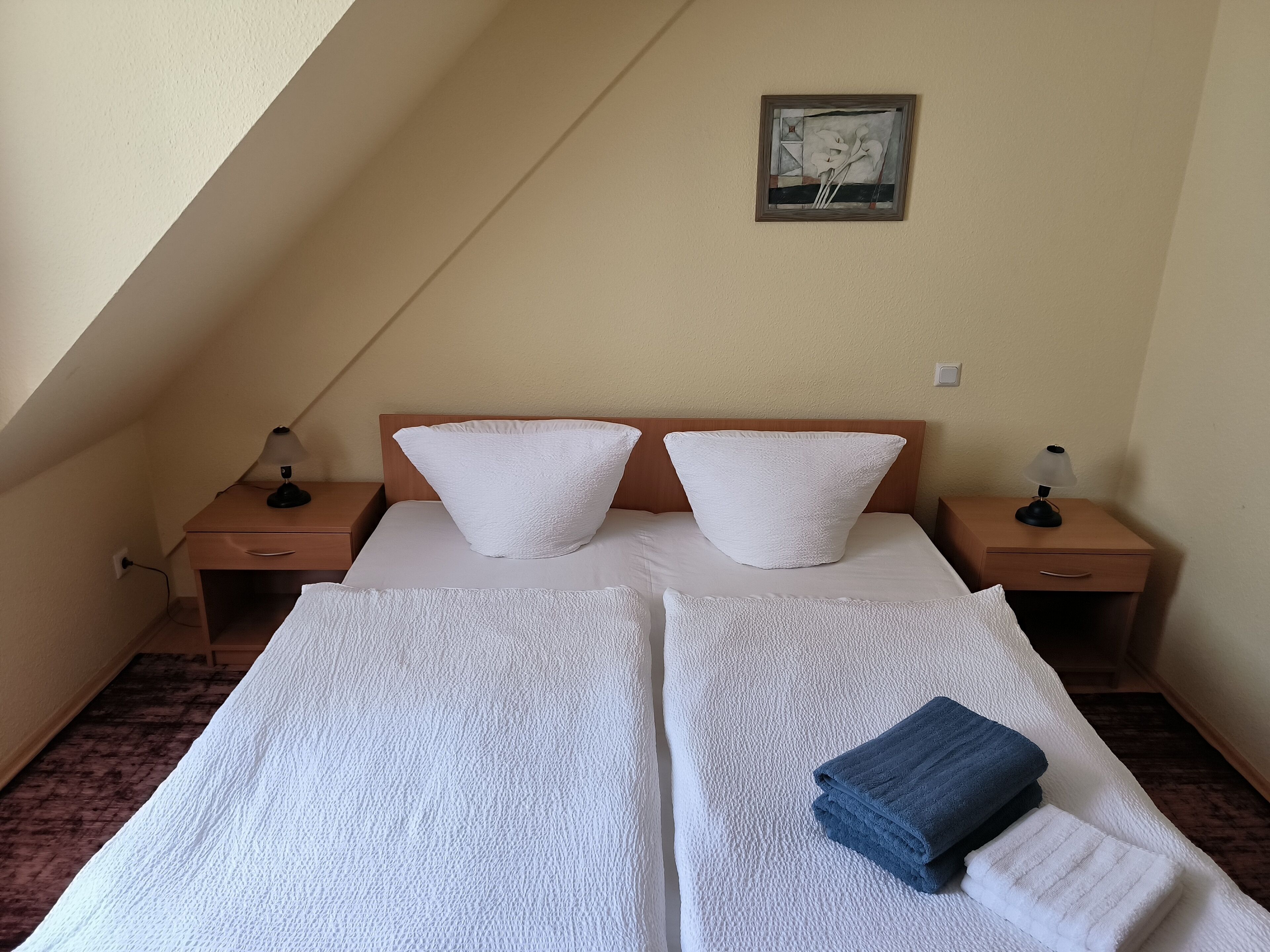 Desk, laptop workspace, bed sheets