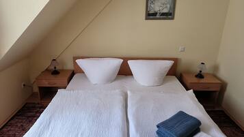Desk, laptop workspace, bed sheets