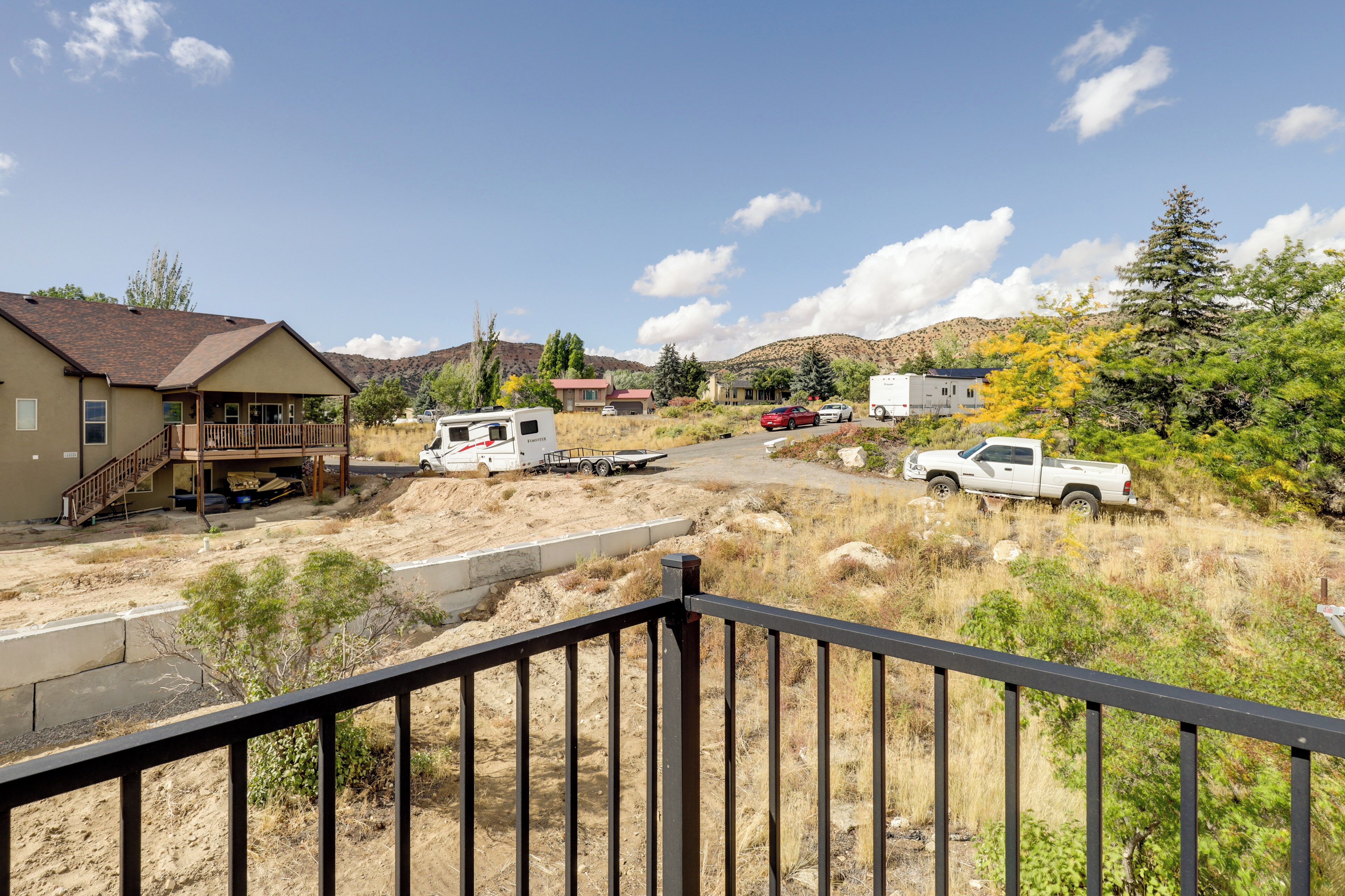 A residential area with houses, a trailer, and a truck.