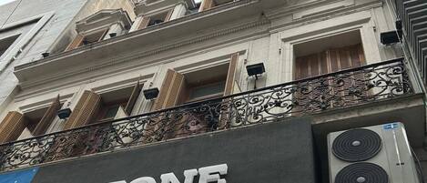 A storefront with a sign that reads 'STONE.'