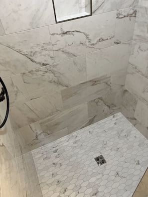 Shower, hair dryer, towels, toilet paper