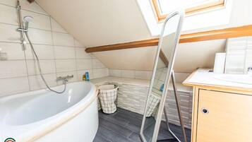 Bathtub, hair dryer, towels