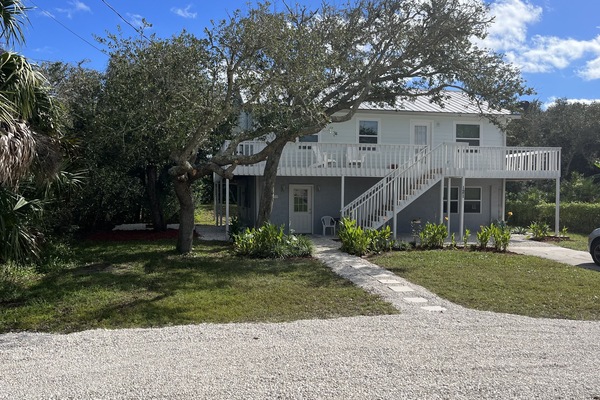 Home with 2 parking spaces on gravel and 2 spaces in driveway.