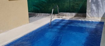 A modern and spacious house, steps to the beach with a private pool!!