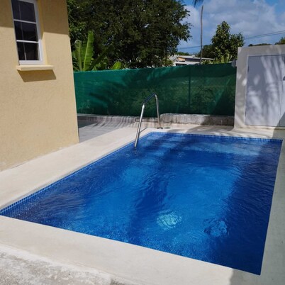A modern and spacious house, steps to the beach with a private pool!!