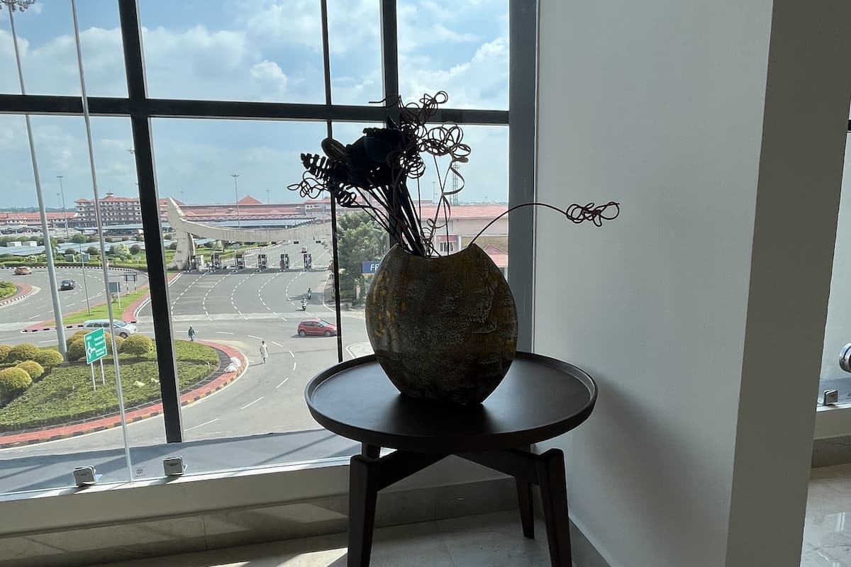 presidency airport view suite with free airport pickup/drop | living area | 81-cm smart tv with digital channels, pay films, streaming services