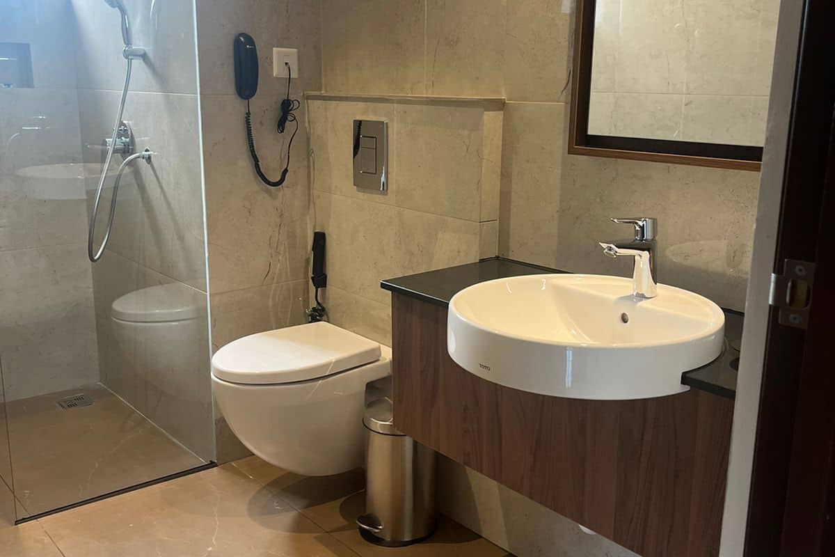 deluxe room | bathroom | shower, hydromassage showerhead, designer toiletries, hair dryer