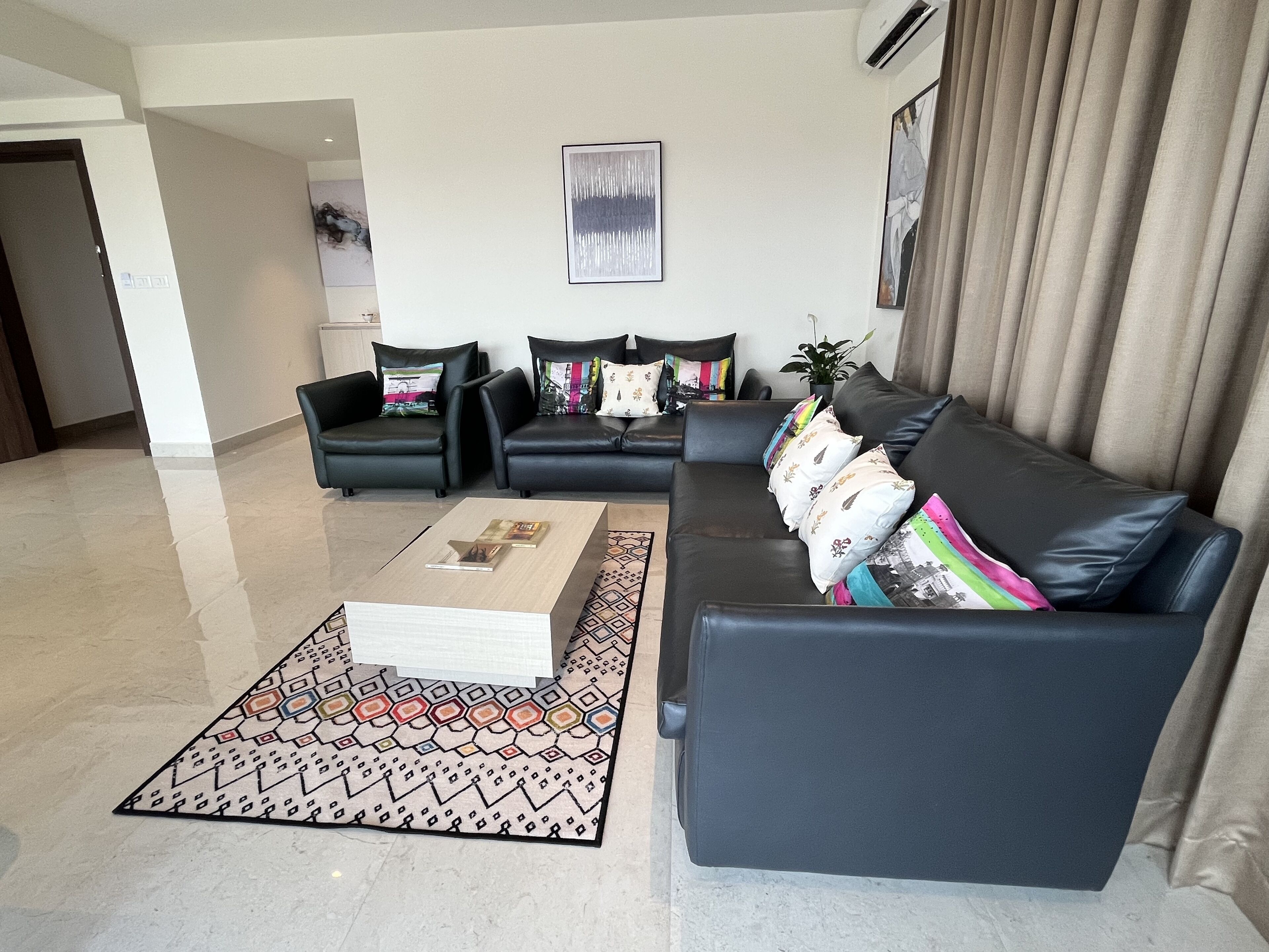 presidency airport view suite with free airport pickup/drop | living area | 81-cm smart tv with digital channels, pay films, streaming services