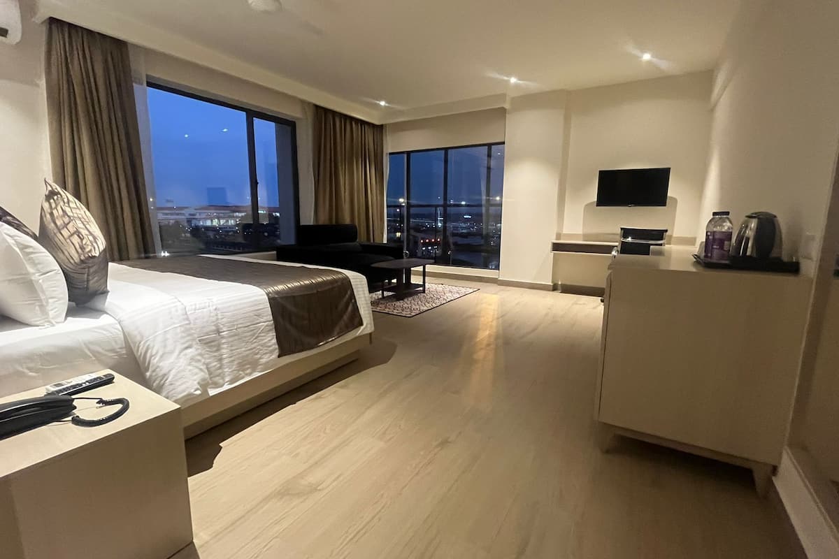 executive airport view rooms with free airport pick up/drop | 1 bedroom, hypo-allergenic bedding, down duvets, memory-foam beds