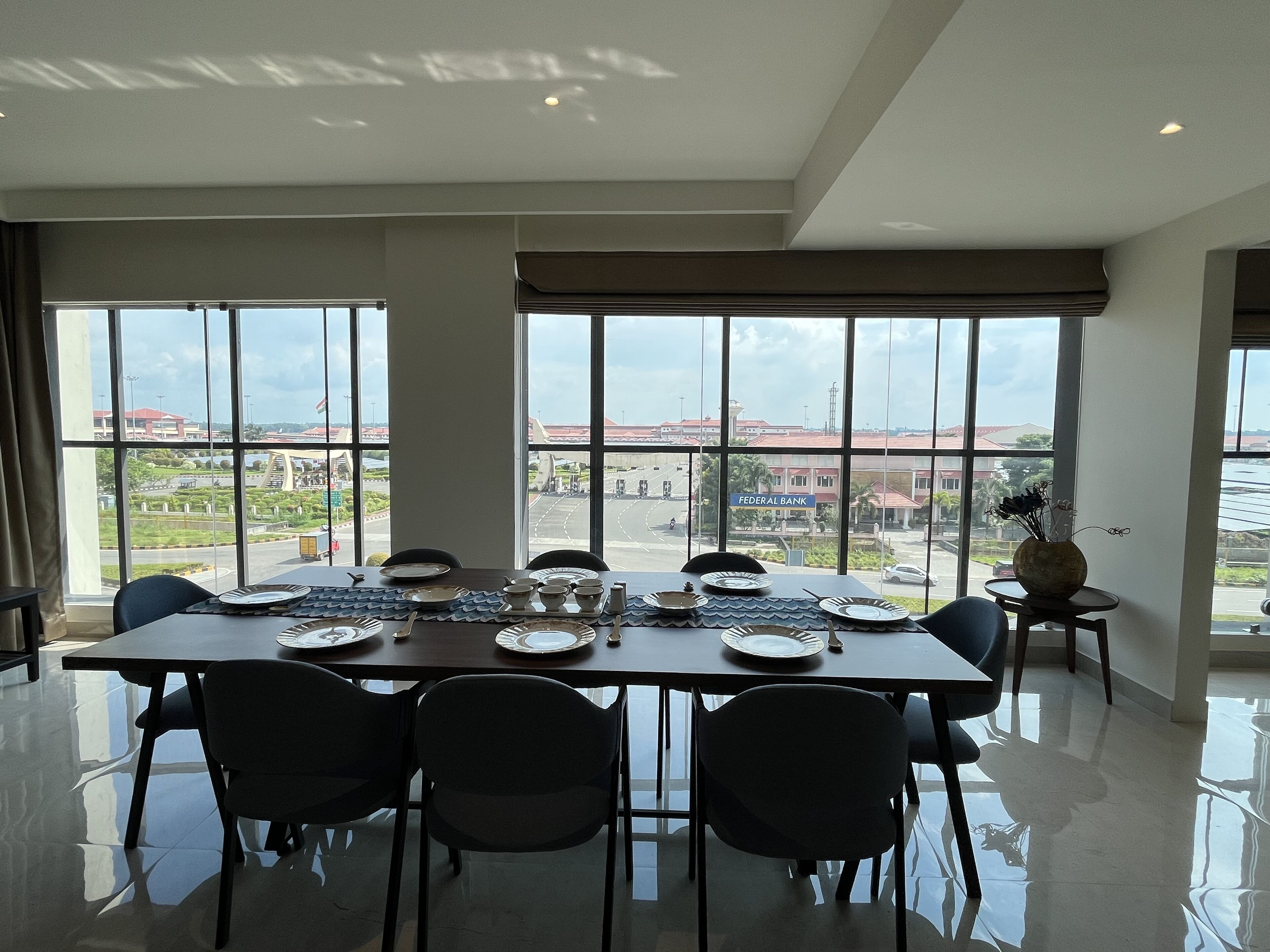 presidency airport view suite with free airport pickup/drop | living area | 81-cm smart tv with digital channels, pay films, streaming services