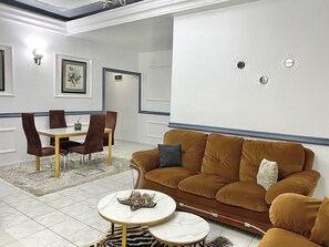 Premium Apartment | Living area | 55-inch Smart TV with cable channels, Netflix, streaming services