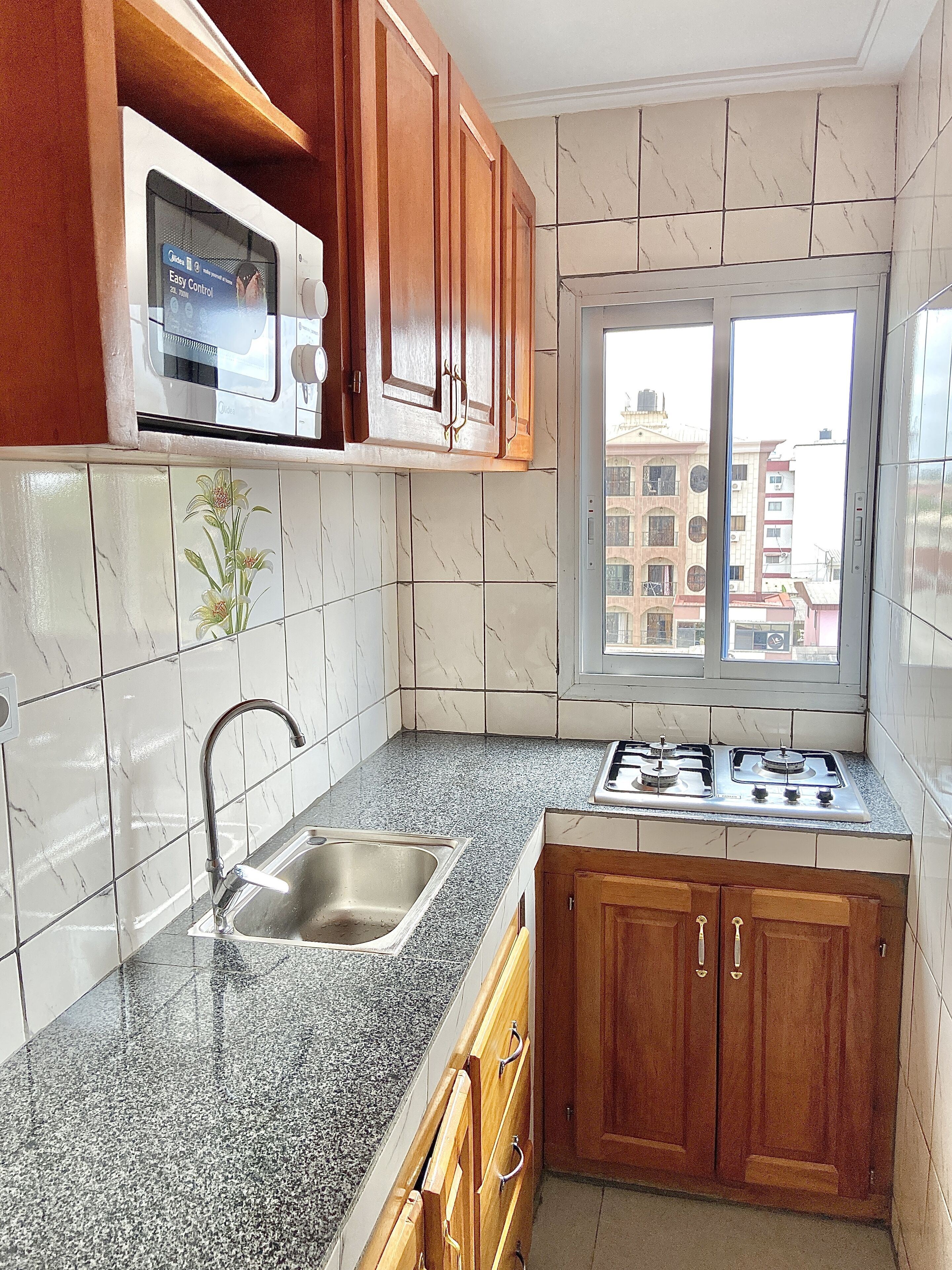 Premium Double Room | Private kitchen | Highchair, cleaning supplies, paper towels