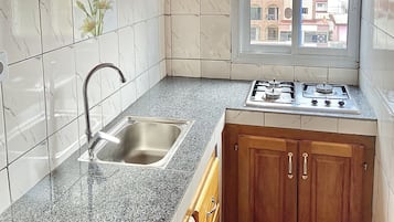Premium Double Room | Private kitchen | Highchair, cleaning supplies, paper towels