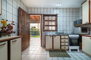 Villa | Private kitchen | Fridge, microwave, oven, blender