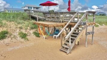 On the beach, sun loungers, beach towels
