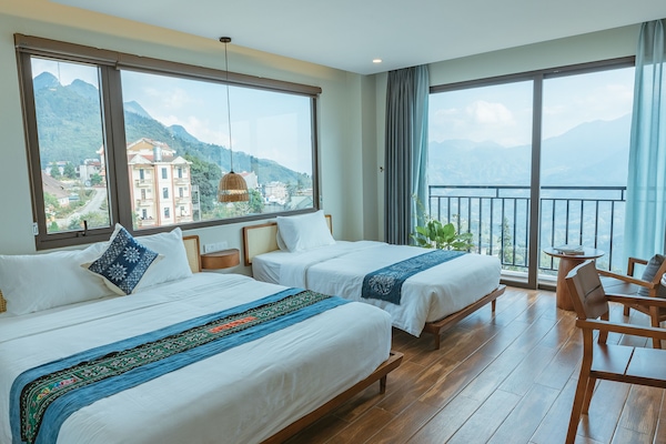 Deluxe Triple Room | Pillowtop beds, desk, laptop workspace, blackout drapes