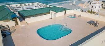 Brand new 3BR/2Bath condo with rooftop pool/hot tub on very quiet beach