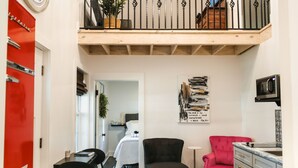 A compact living space with a loft area, a kitchenette, and a dining area. - A fun & happy guesthouse with a loft!  Located 15 min. from Erskine College.  (Honea Path)