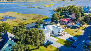 A coastal property with a large body of water, several houses, and a dock. - A Turtle's View-Waterfront-Dock-Fenced Yard-Dog Friendly (Surf City)
