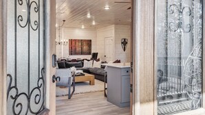 A modern living room with a sofa, coffee table, and artwork on the wall. - Brand New Near PF~Royal Ridge~Indoor Pool-Racing Games (Sevierville)