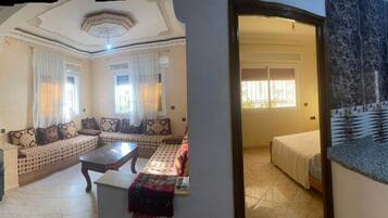 Apartment, 2 Bedrooms, Beach View, Beachfront | Living area | 40-inch plasma TV with satellite channels