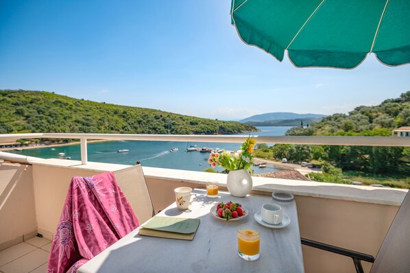 Outdoor dining - Anna: Charming Corfu Apartment - Cozy for Couples, Sea Views, WiFi (Saint Stephanos N/E)