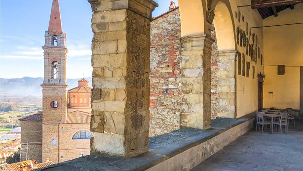 A historic building with a bell tower, stone arches, and a view of the surrounding landscape. - Gorgeous home in Castiglion Fiorentino (Castiglion Fiorentino)