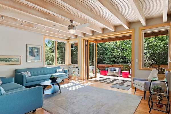Beautiful living room with french doors which open to a garden.