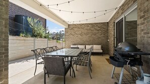 Relax outdoors with a barbecue grill and comfortable seating area.