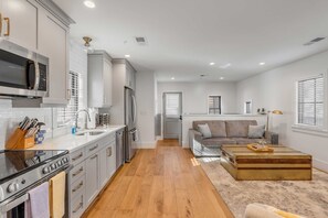 Fridge, stovetop, dishwasher, coffee/tea maker