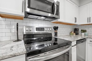 Fridge, microwave, oven, stovetop - The Schumacher Townhouse - 2 BR (Columbus)