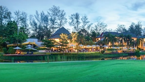 A resort with a pool, outdoor seating, and a well-maintained lawn. - Homm Suites Laguna, part of Banyan Group (Choeng Thale)