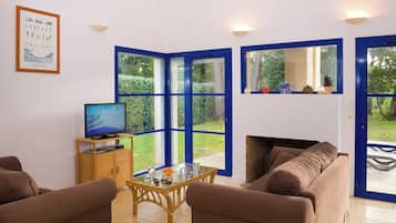 50-inch TV with cable channels, fireplace