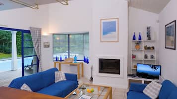 50-inch TV with cable channels, fireplace