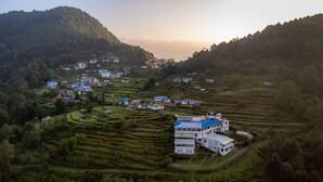 A rural village with terraced fields and houses.