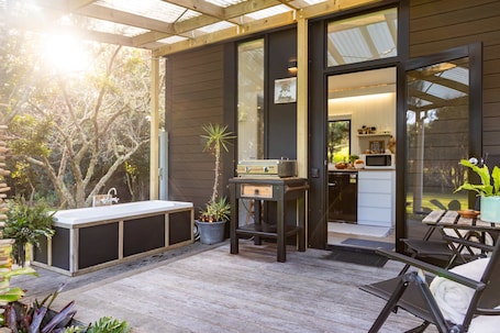Outdoor dining. Creekside at Kuaotunu by Tiny Away