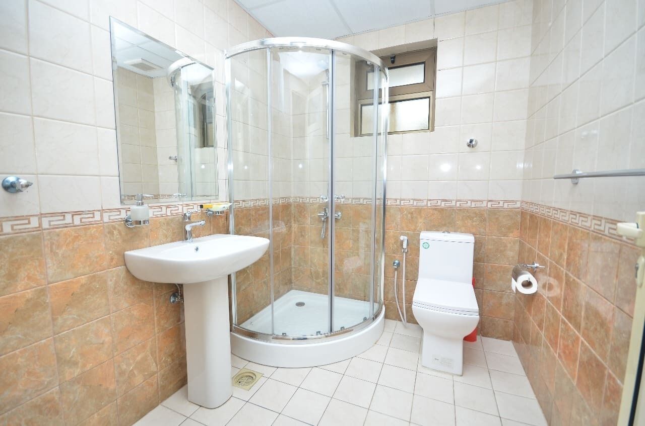 Separate tub and shower, rainfall showerhead, free toiletries, slippers