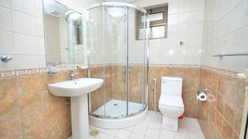 Separate tub and shower, rainfall showerhead, free toiletries, slippers