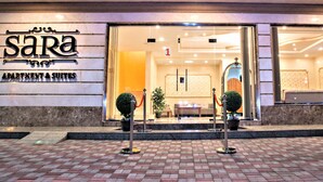 A hotel entrance with a sign reading "SARA APARTMENT & SUITES". - Sara Furnished Apartments (Al Khobar)