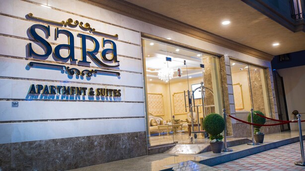 A hotel entrance with a sign reading "SARA APARTMENT & SUITES". - Sara Furnished Apartments (Al Khobar)