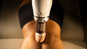 A close-up of a massage device on a person's back.