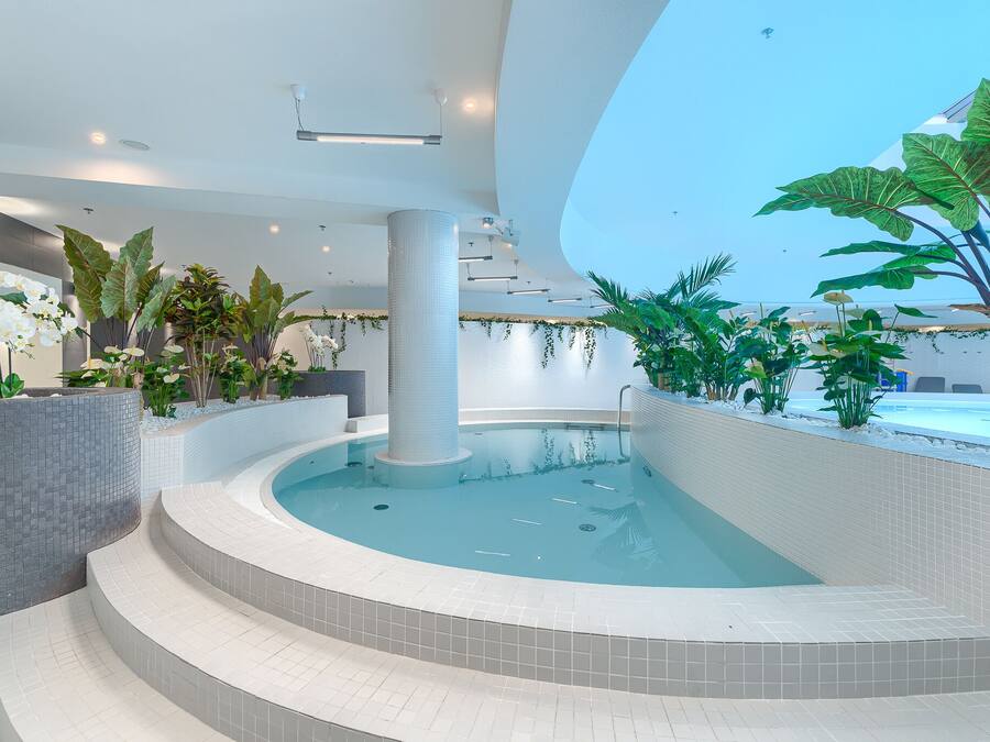 Indoor pool, open 7:00 AM to 10:00 PM, sun loungers, lifeguards on site