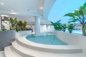 Indoor pool, open 7:00 AM to 10:00 PM, sun loungers, lifeguards on site
