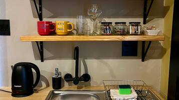Fridge, microwave, electric kettle, cookware/dishes/utensils